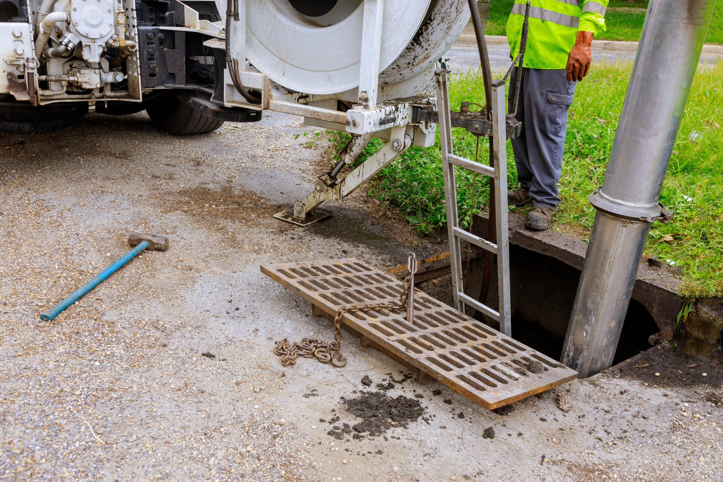 Sewage industrial cleaning truck clean blockage in a sewer line.