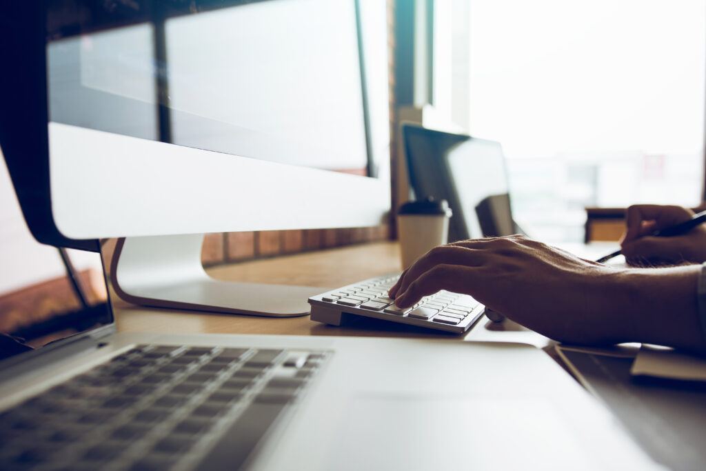 Hand typing on keyboard