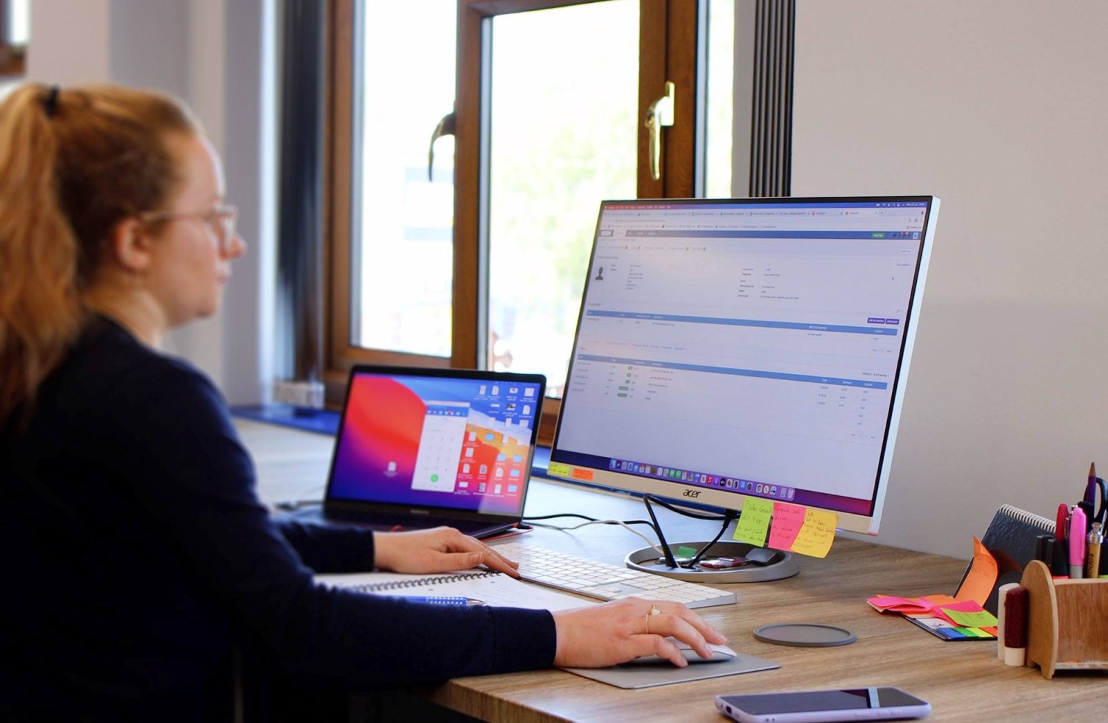 Woman using Commusoft in an office