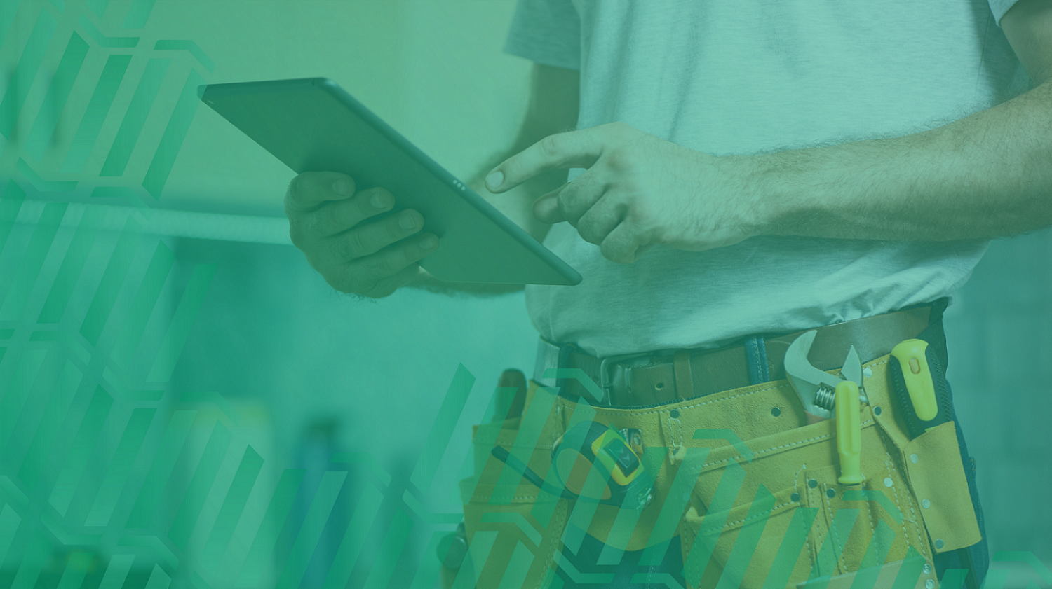 engineer holding tablet with tool belt